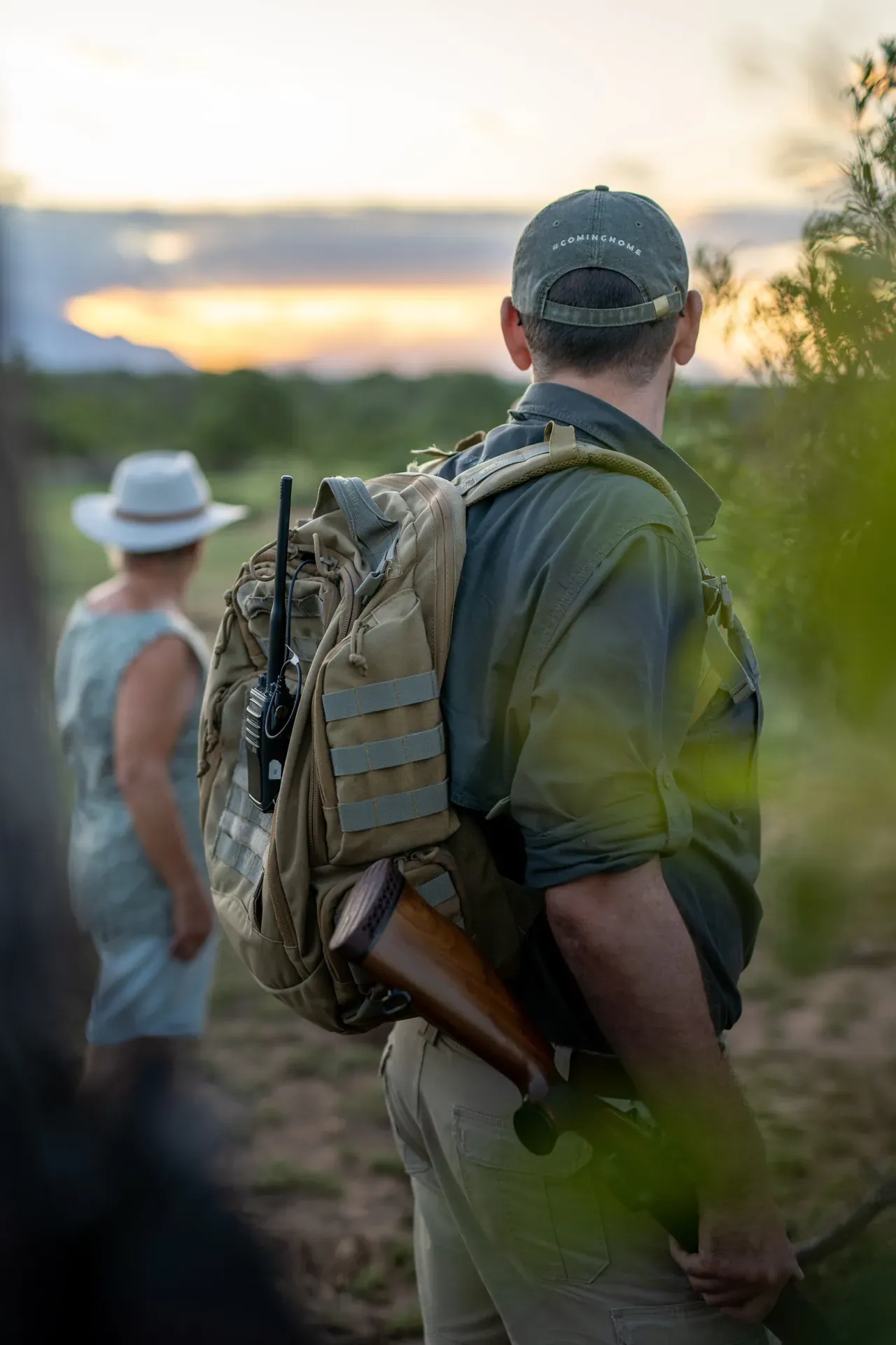 Ranger on a bush walk at Monwana Lodge, carrying a backpack through the African bush.